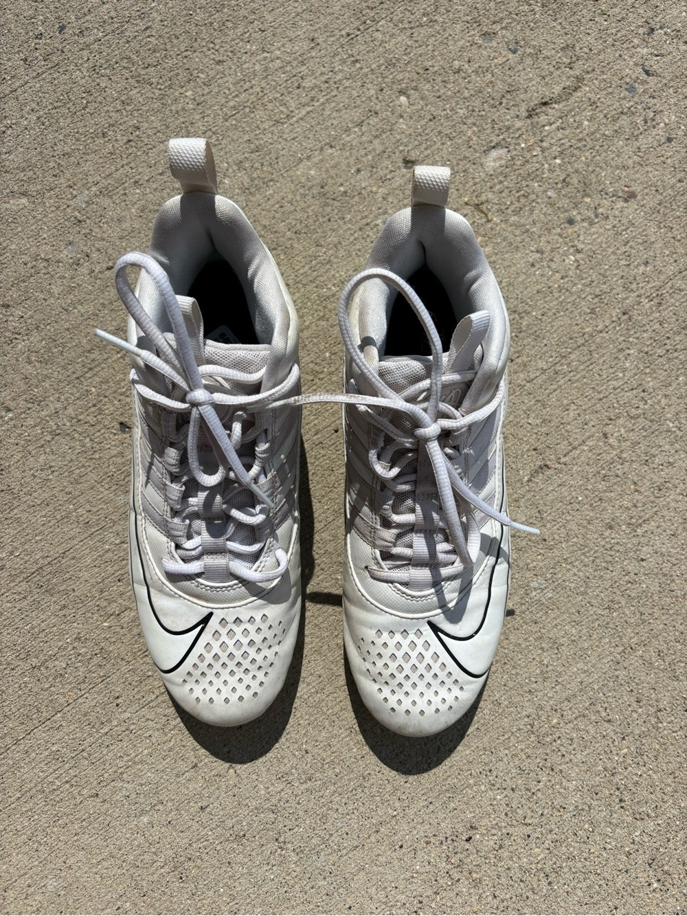 Nike White Cleats with Black Swoosh Accent
